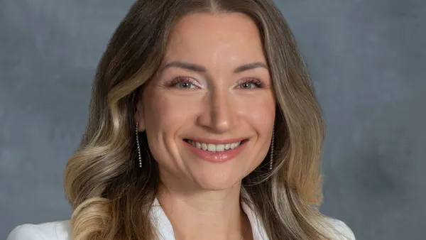 A professional headshot of Maria Gomelsky.