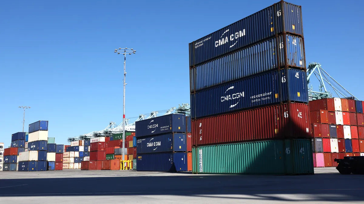 Shipping containers are stacked at the Port of Los Angeles on February 7, 2023 in Los Angeles, California.