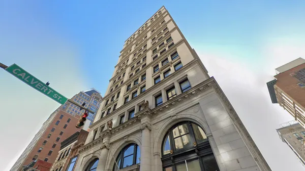 Photo looking up at a high rise building