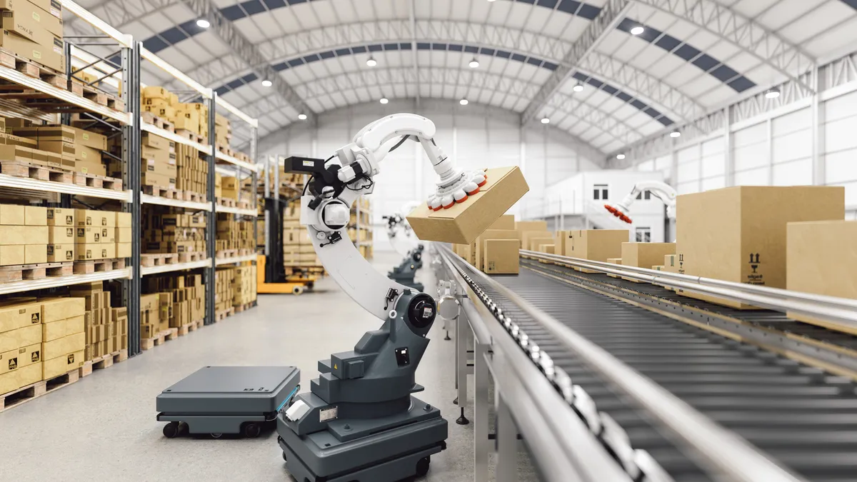 A robot works with boxes on a conveyor belt in a warehouse.