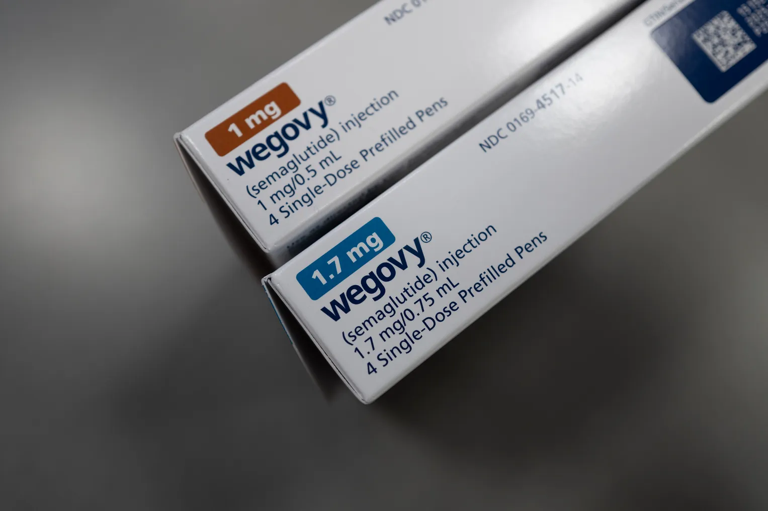 Two prescription drug cartons are seen standing vertically on end, bearing the word Wegovy.