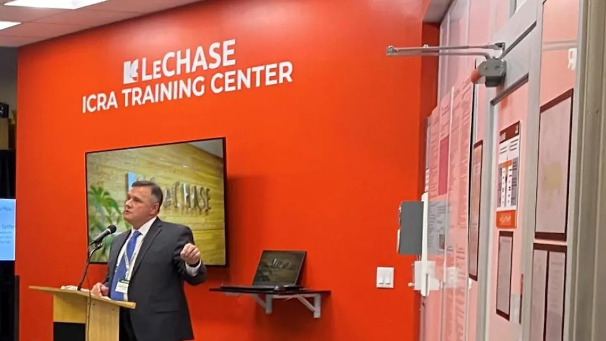 David Campbell, LeChase Vice President, speaks at the ribbon cutting for the training facility.