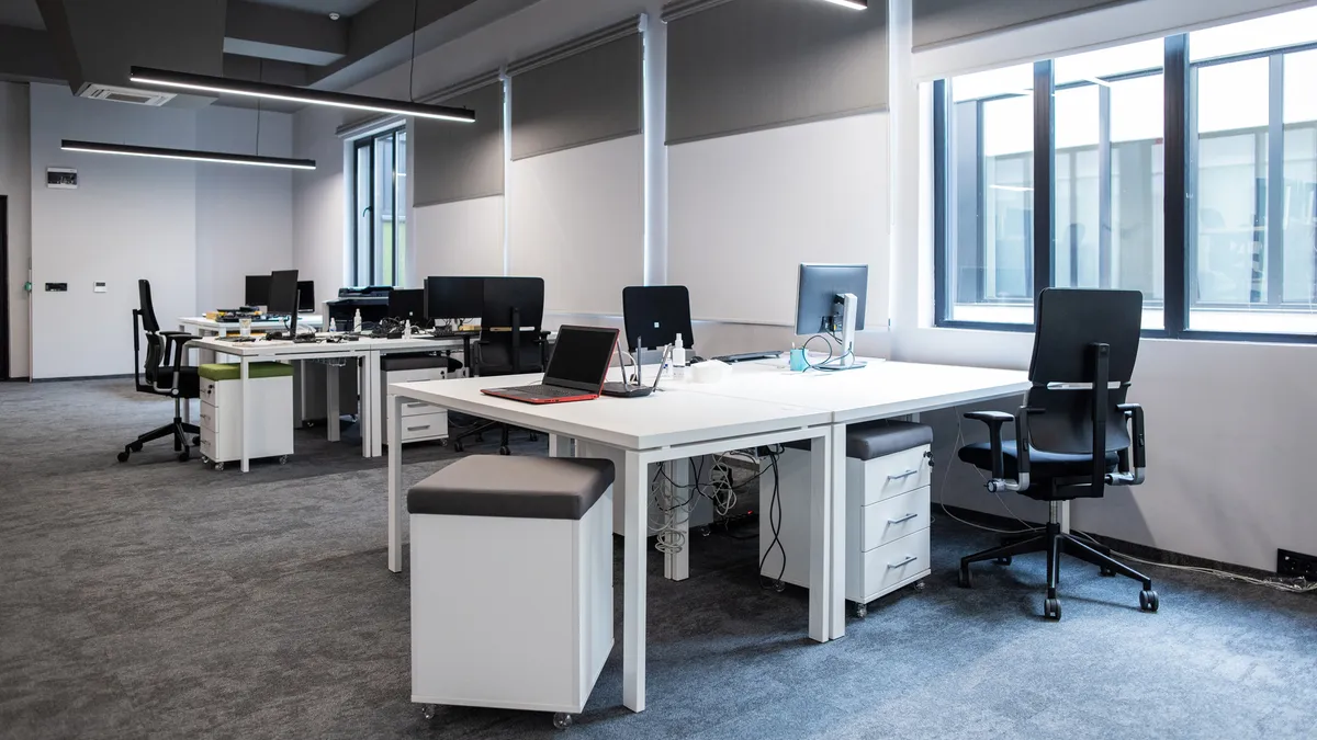 An empty office with computer equipment