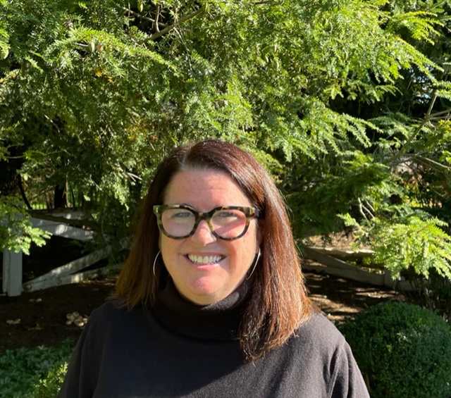 A headshot of Mary-Farrel Tarbox, REI's vice president of physical stores and retail operations.