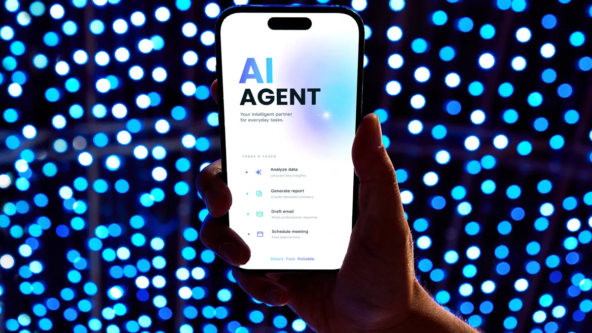 Hand holding modern smartphone with an AI agent application on screen.