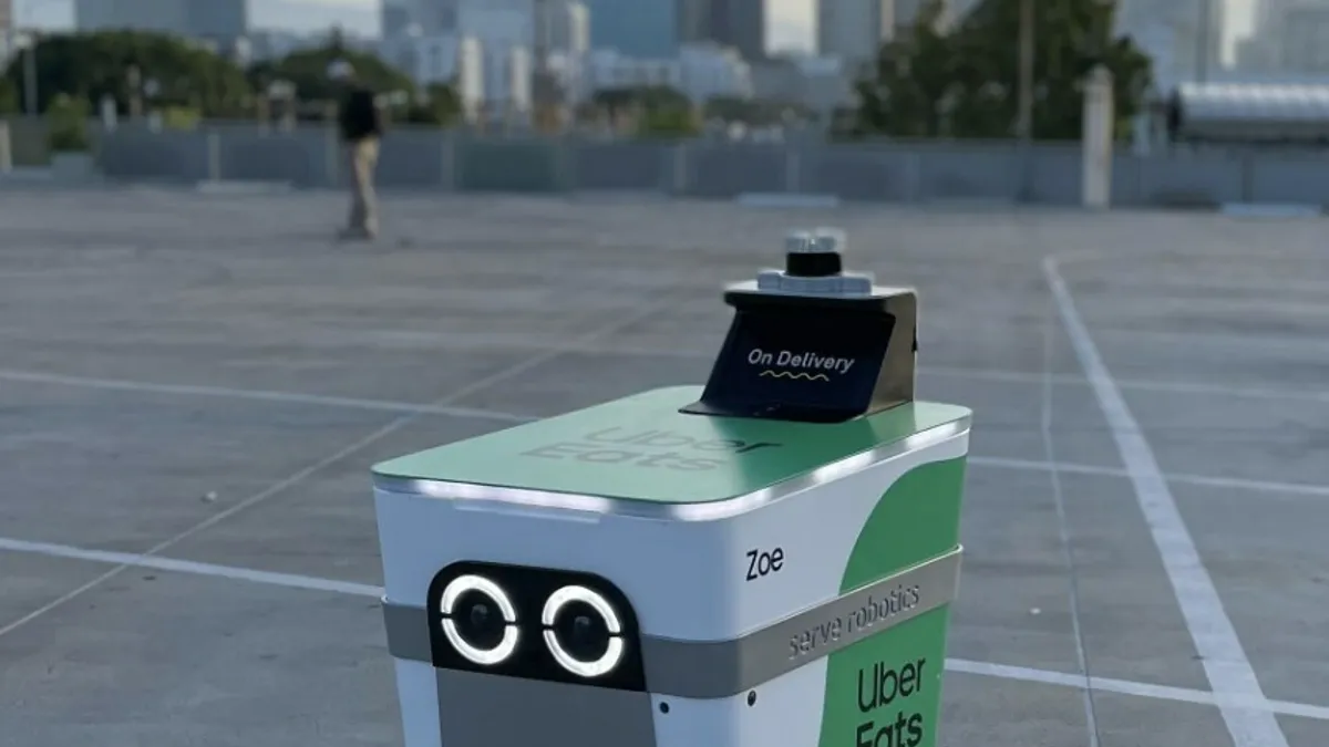 A Serve Robotics robot featuring the Uber Eats logo.