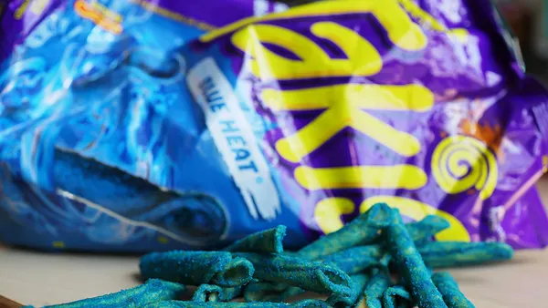 A Takis Blue Heat bag is seen on a table