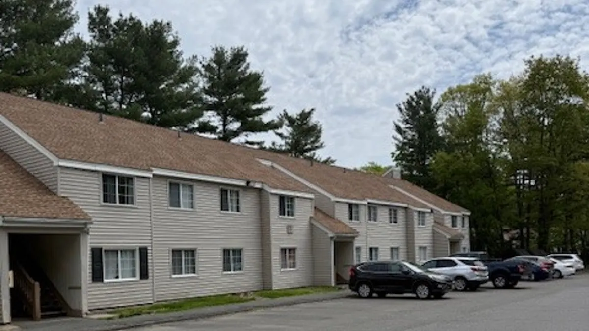 Beige garden-style apartments.