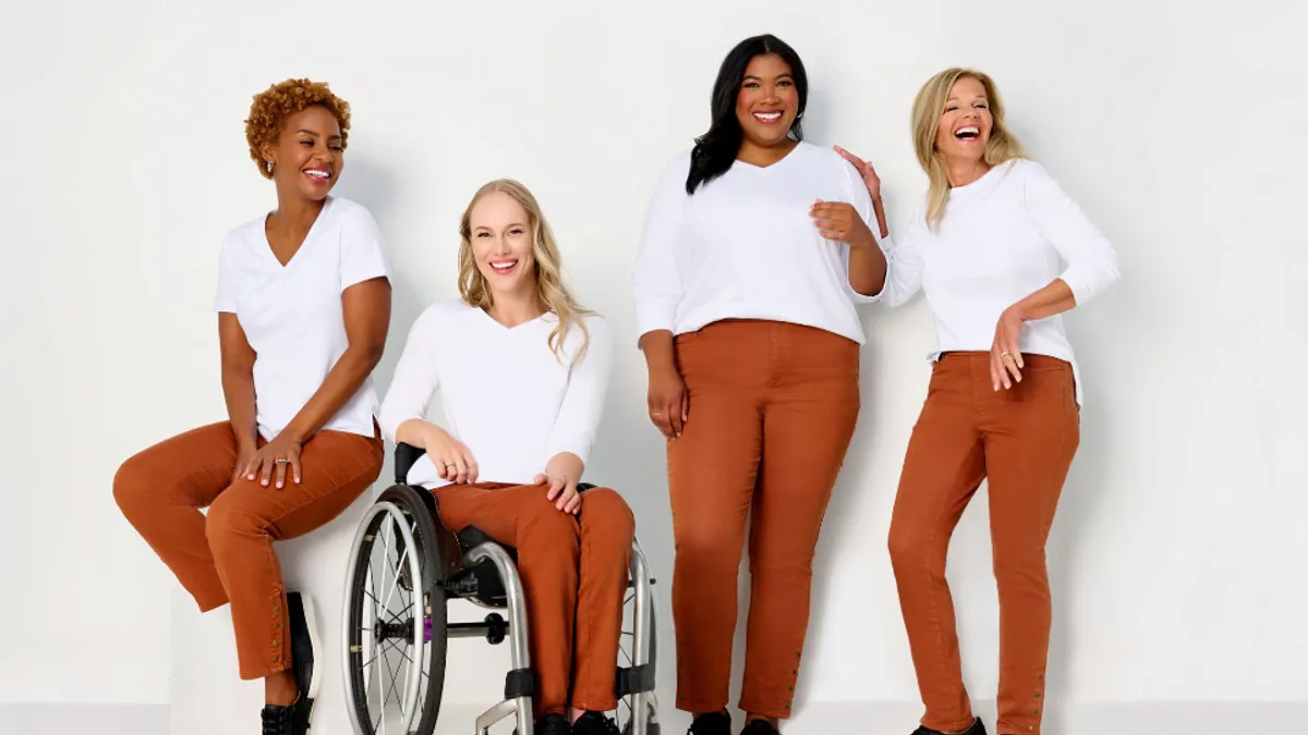 A group of people together modeling adaptive clothing.