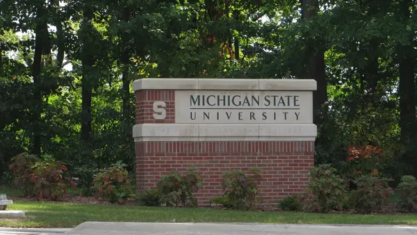 A sign welcoming the public to Michigan State University.