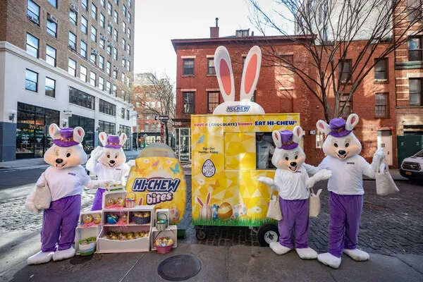 Hi-Chew mascots outside a a display of  its Save a (Chocolate) Bunny, Eat HI-CHEW campaign for Easter