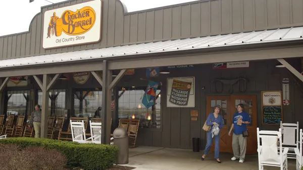 Customers depart a Cracker Barrel storefront