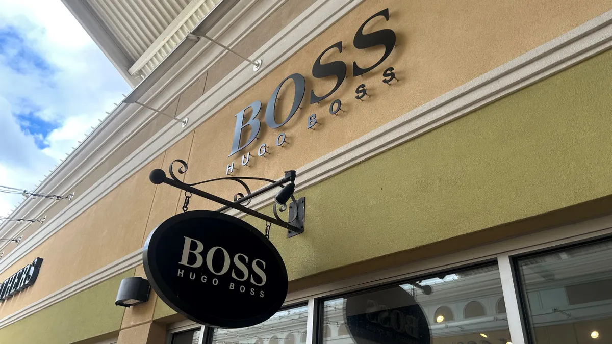A Boss by Hugo Boss sign hangs above a store