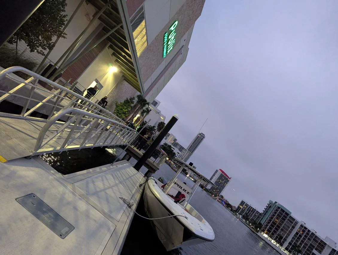 Crooked image of a boat dock in front of a Publix grocery store