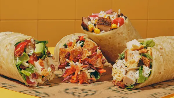 A close-up photograph of coure wraps on a yellow table in front of an orange titled background.
