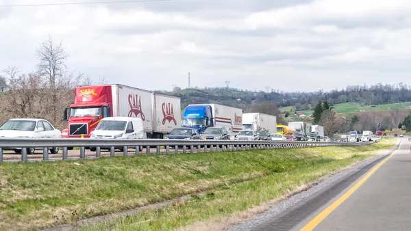 Commercial and passenger vehicles cars stuck on a highway traffic jam in April 2018.