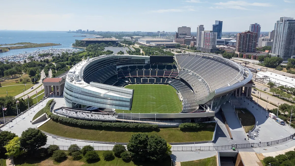 A shot of a stadium in the direct sunlight. The stadium is empty, and no game is taking place.