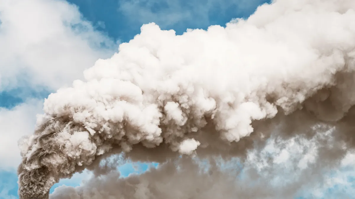 Thick smoke billowing into the sky from a factory chimney.