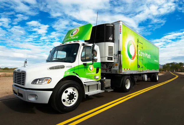 A photo of an 18-wheel truck. The branding on the side says Core-Mark