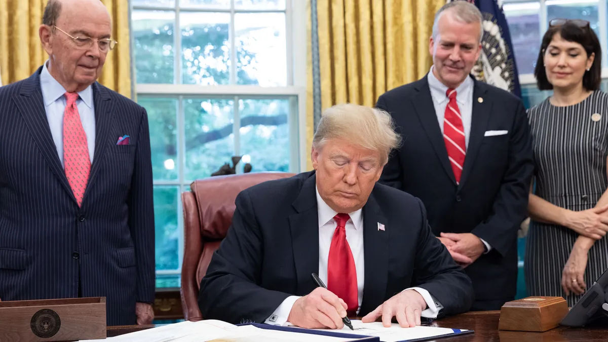 President Donald J. Trump signs S.3508-Save Our Seas Act of 2018 Thursday, Oct. 11, 2018, in the Oval Office of the White House.