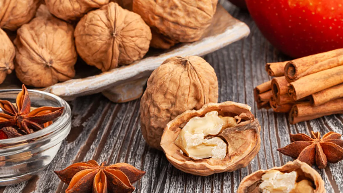 sliced walnuts group on wood