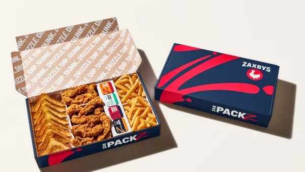 A large Zaxbys chicken finger pack. Many chicken fingers, pieces of toast and fries in a box.