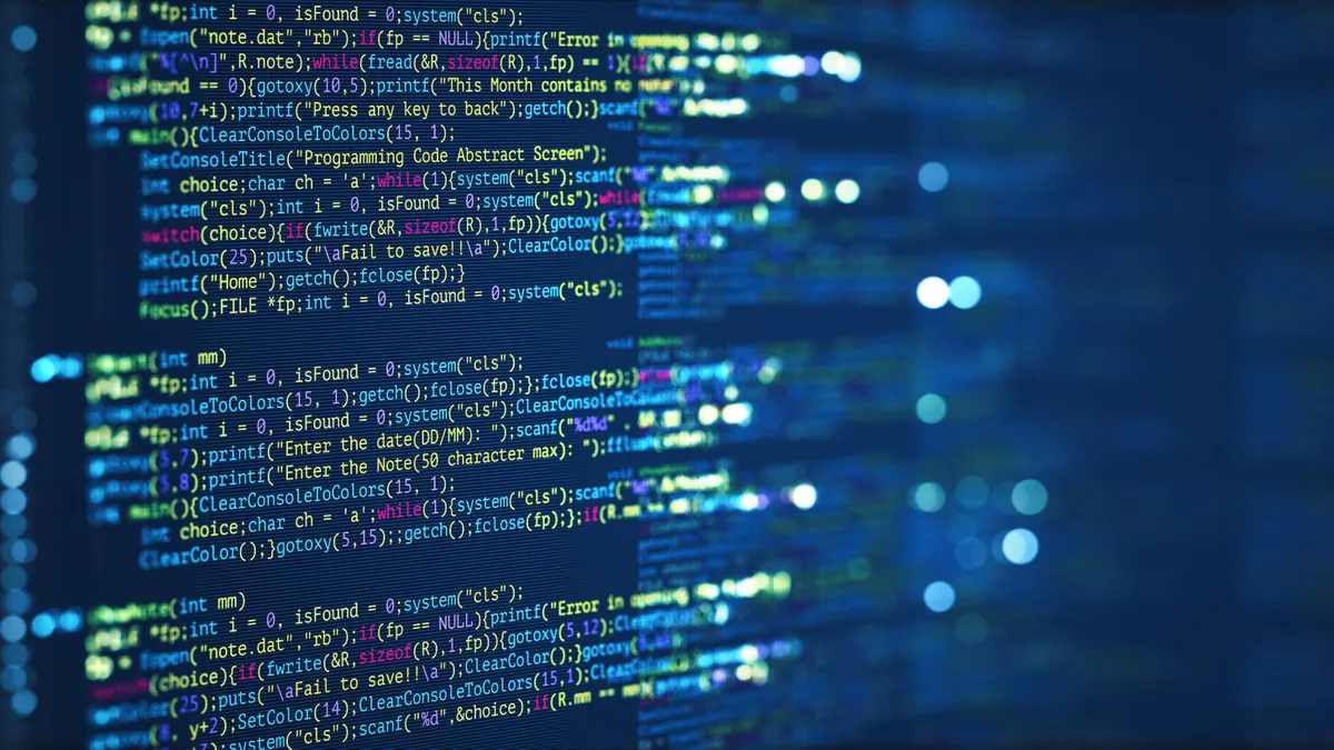 Abstract image of a computer screen with coding language pictured on it.