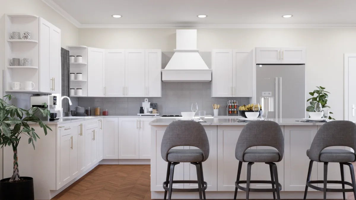 A kitchen with white cabinets.