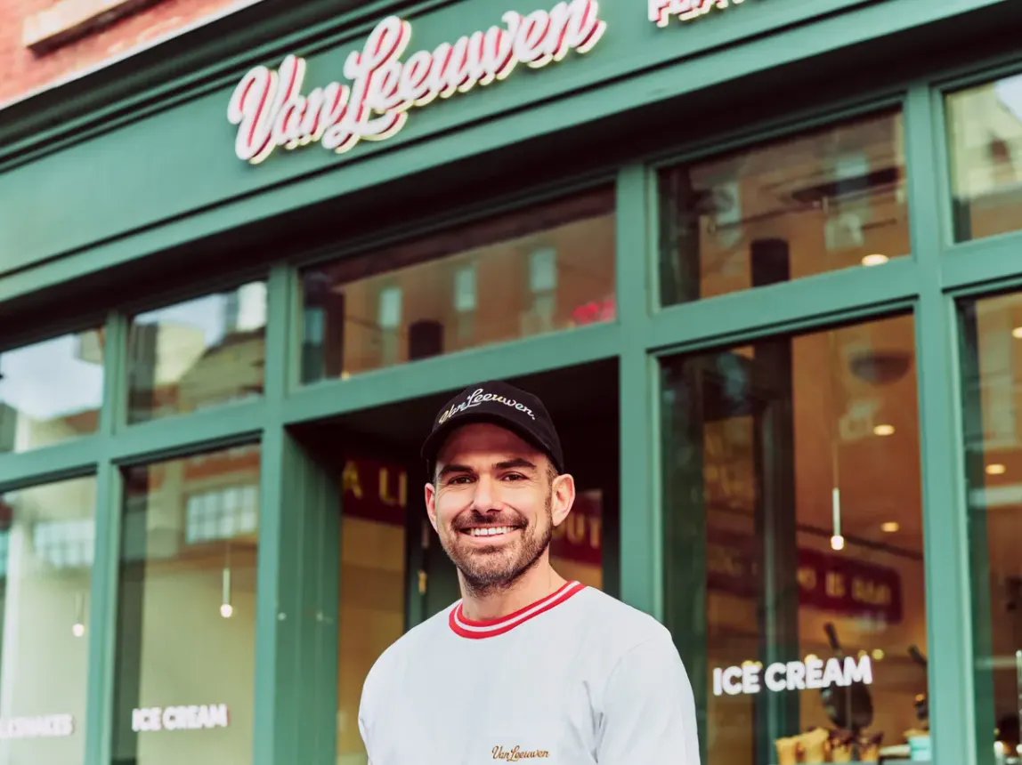 Ice cream store owner in front of shop
