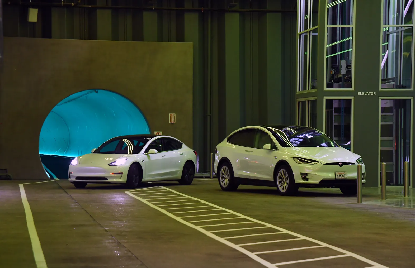 Tesla cars drive in the Central Station during a media preview of the Las Vegas Convention Center Loop on April 9, 2021 in Las Vegas, Nevada.