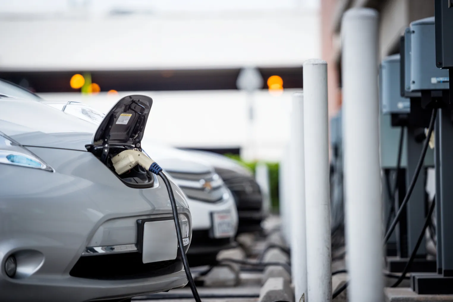 Electric vehicles at an EV charging station.