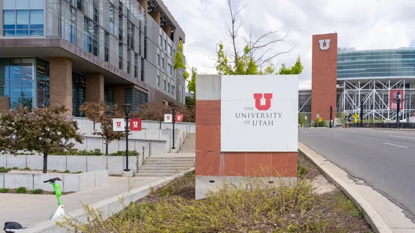A sign on the University of Utah's campus bearing the institution's name.