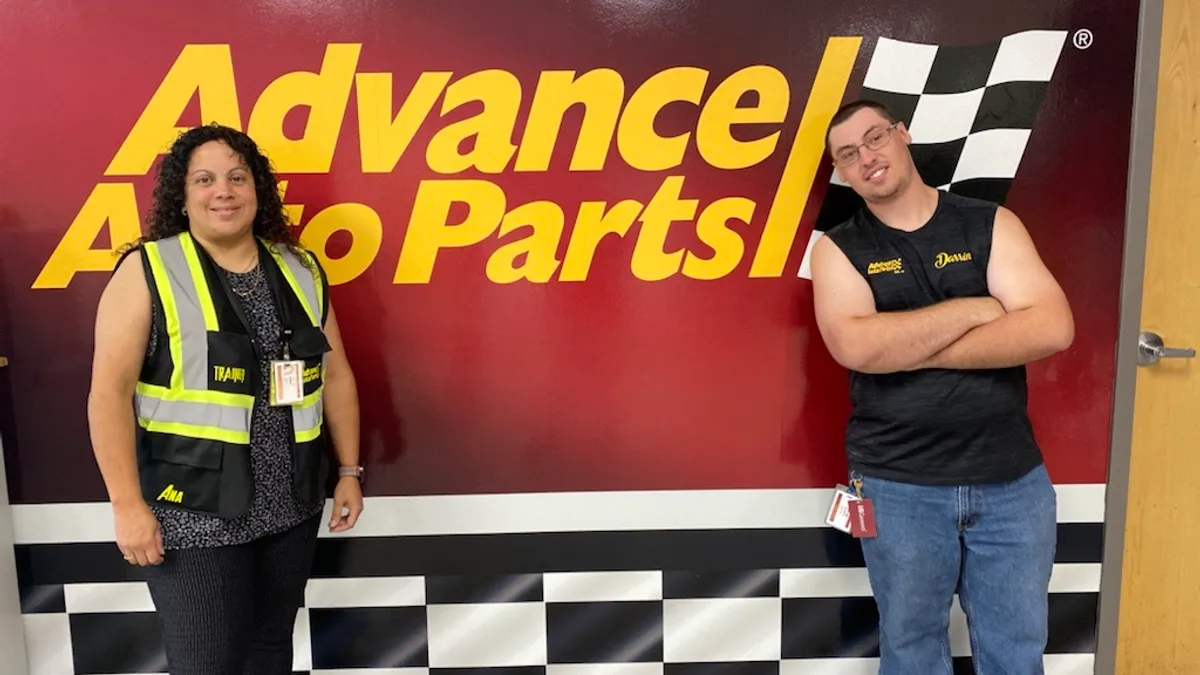 Darrin Masters poses alongside Jenny Ramos, head trainer at Advance Auto Parts' Kutztown distribution center.