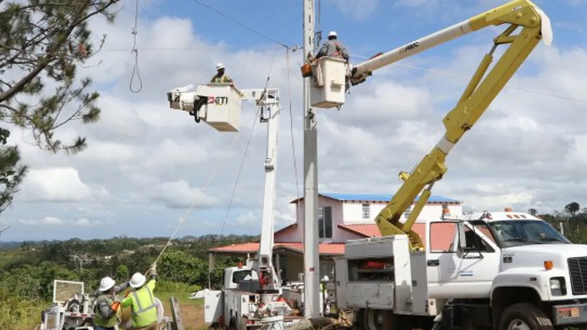 Utility workers in Puerto Rico attempt to restore power during an outage.