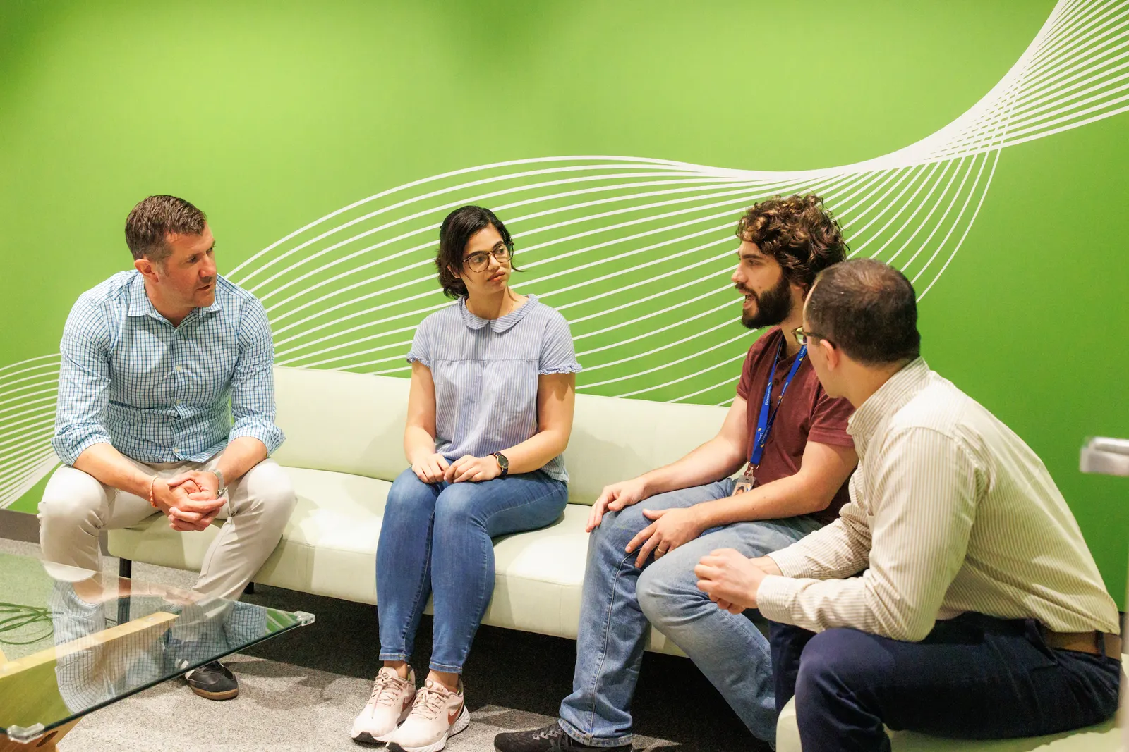 A group of four people seated at Braskem's Renewable Innovation Center in Lexington, Massachusetts