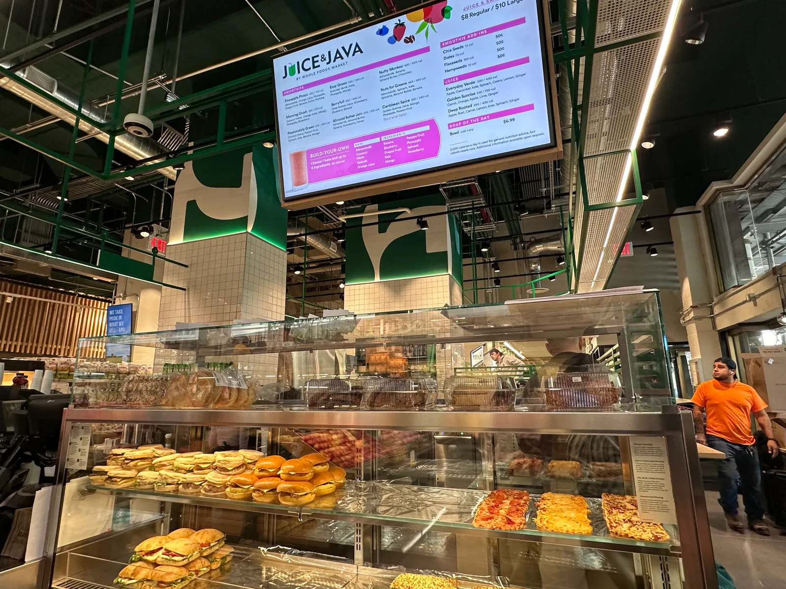 Juice &amp; Java counter at Whole Foods Daily Shop with glass display counter showing pastries and sandwiches