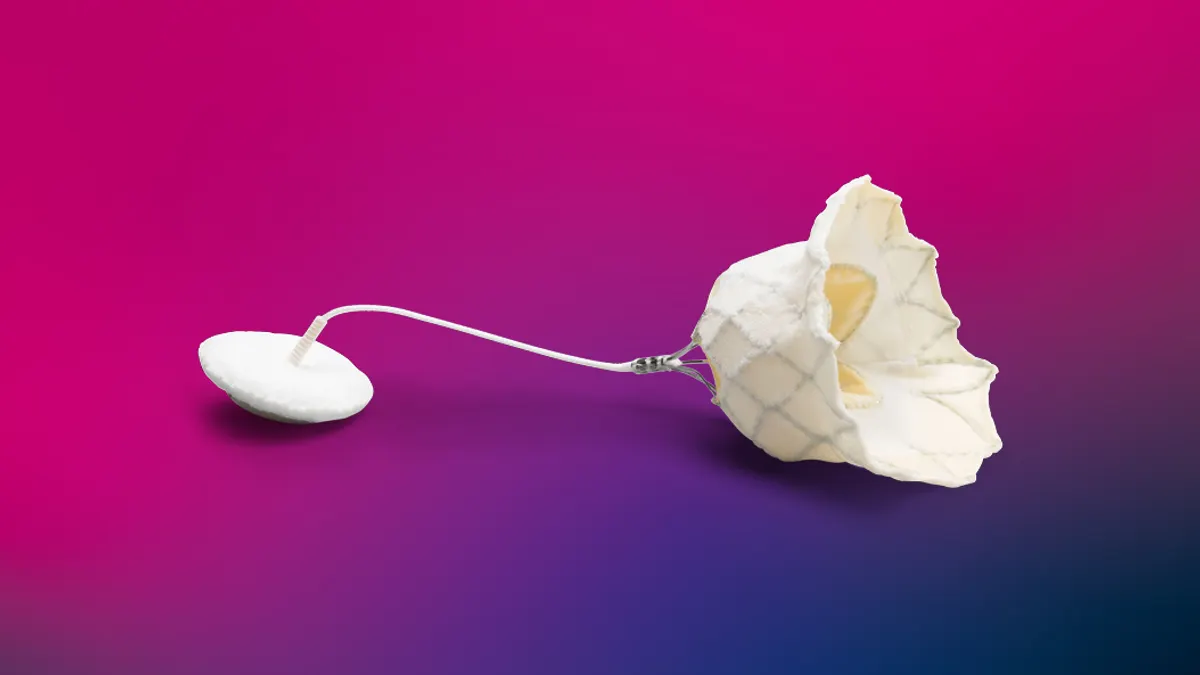 The white Abbott Tendyne mitral valve is shown against a bright pink background.