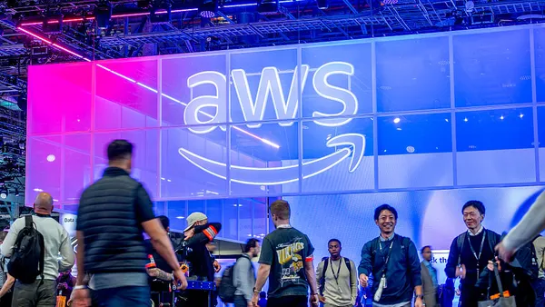 Attendees walk through an expo hall during AWS re:Invent 2025, a conference hosted by Amazon Web Services, at The Venetian Convention & Expo Center on December 2, 2025 in Las Vegas, Nevada.