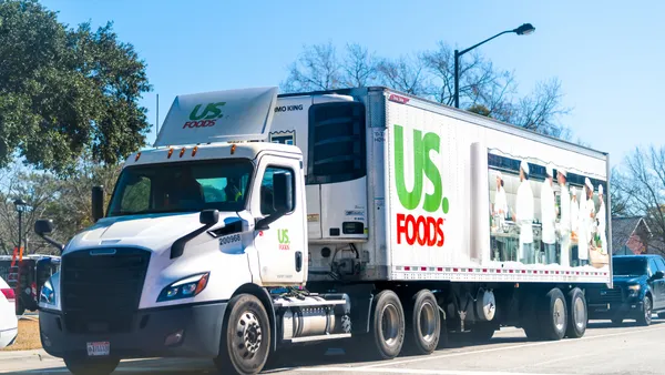 A US Foods tractor-trailer transporting products in South Carolina between passenger vehicles.