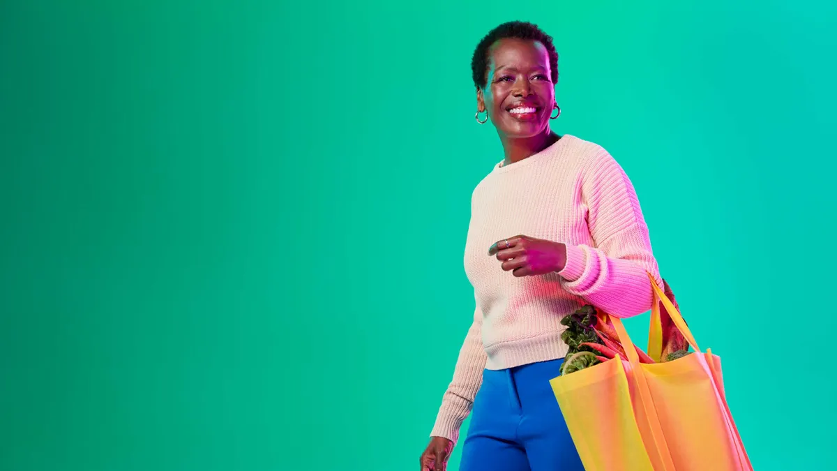 Woman carrying grocery bag