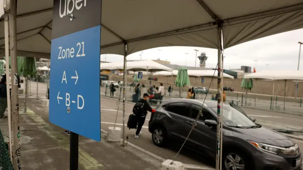 Uber customer gets into a car at Los Angeles International Airport on March 10, 2026