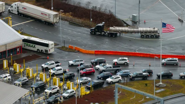 aerial view of trucks entering US from Canada