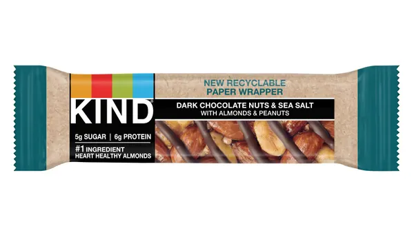 A Kind snack bar that has messaging on the label indicating the new paper wrapper is recyclable.