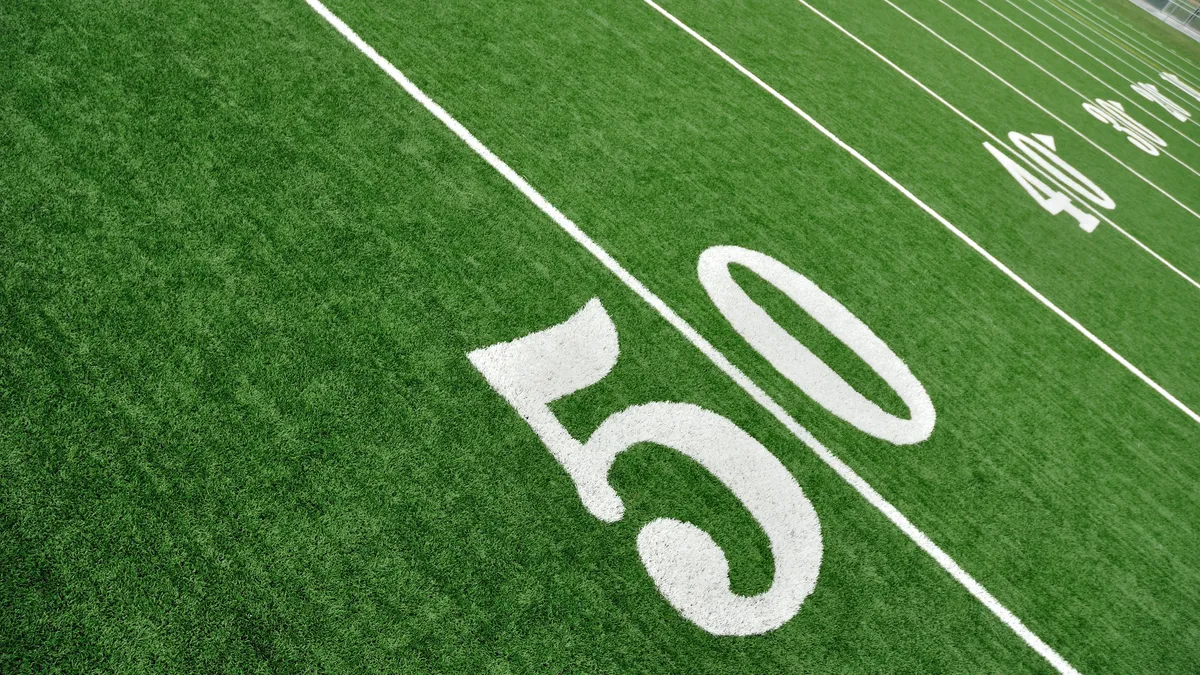 A photo of the 50-yard line on an American football field