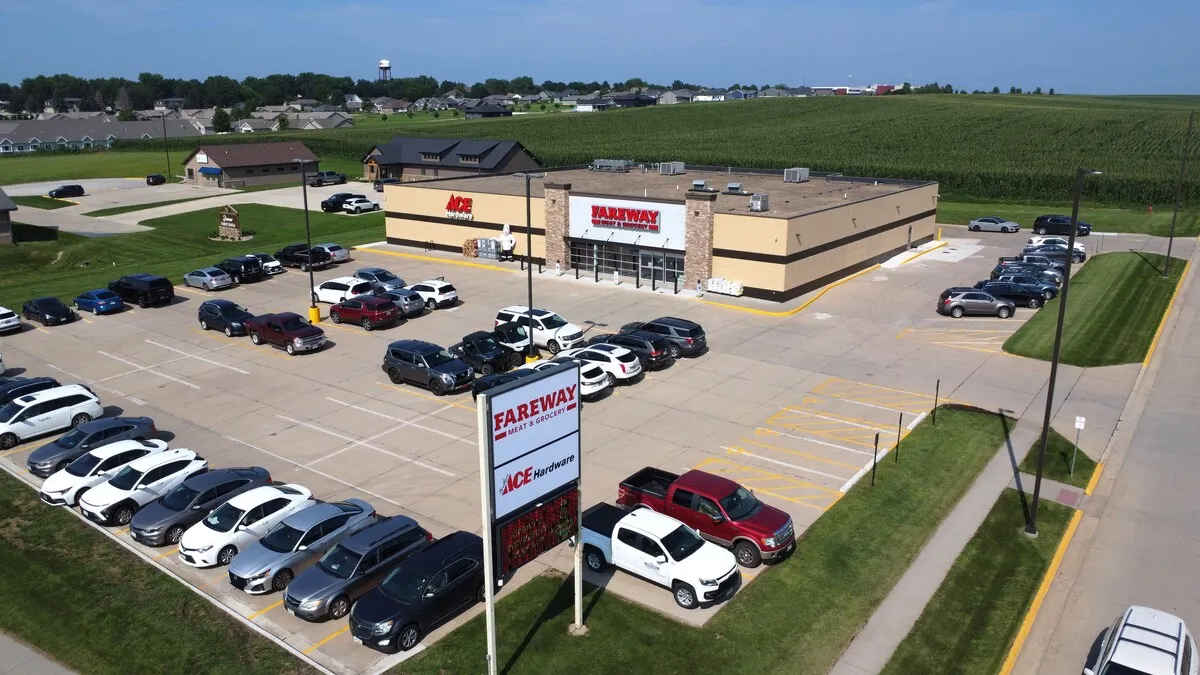 Overhead shot of a grocery store and a parking lot.