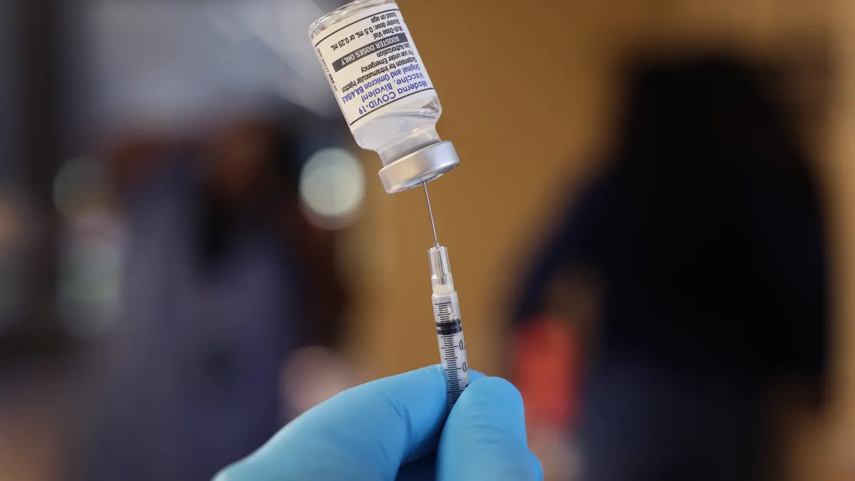 A pharmacist prepares to administer COVID-19 vaccine booster shots on September 09, 2022 in Chicago, Illinois.