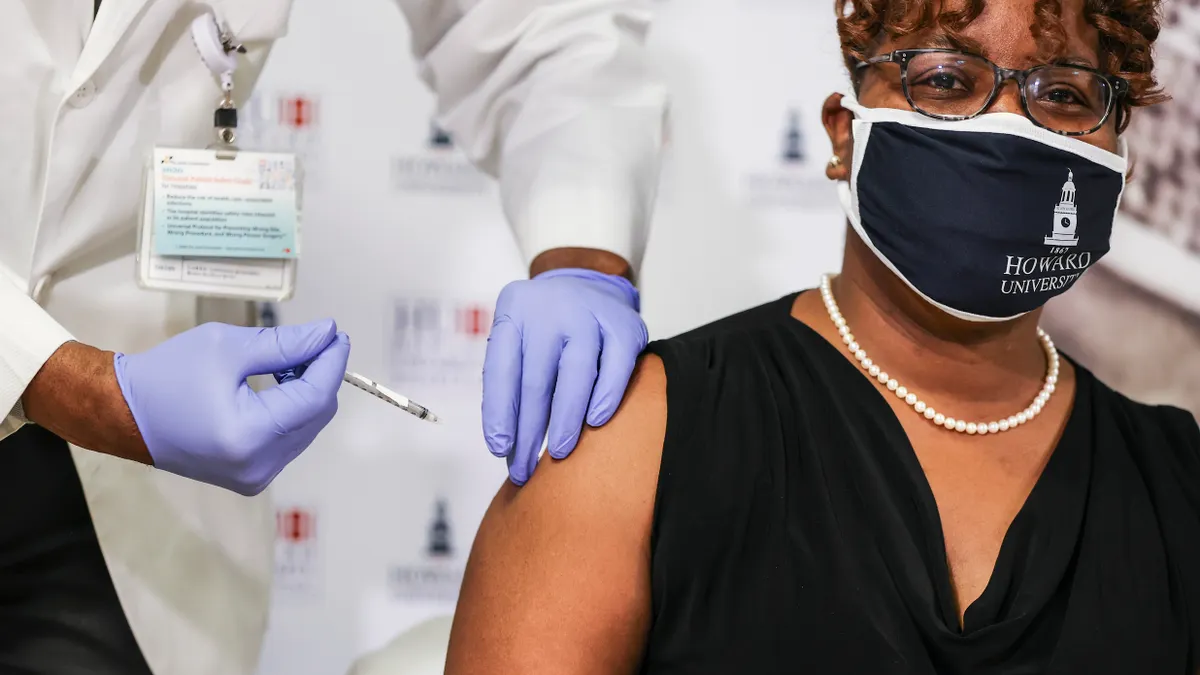 A woman receiving a covid vaccine