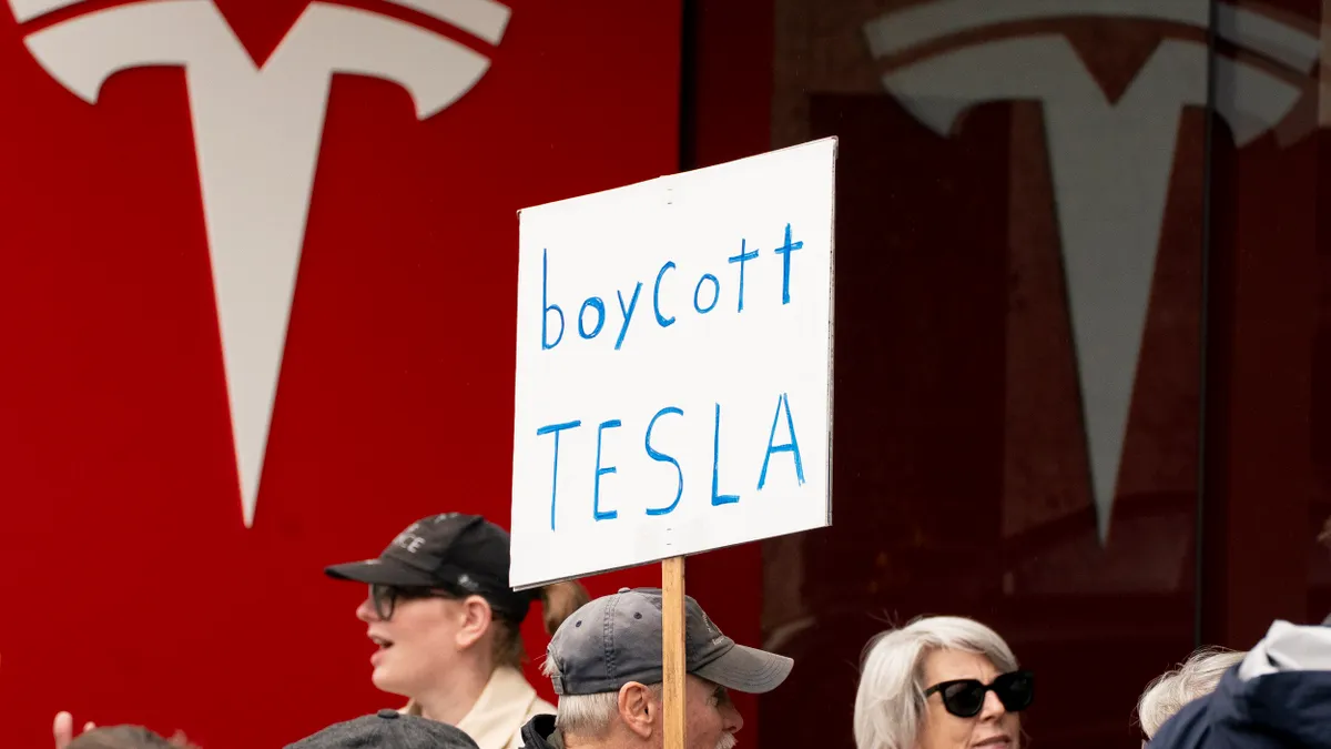 Demonstrators protest against Elon Musk on Feb. 22, 2025 in Seattle, Washington