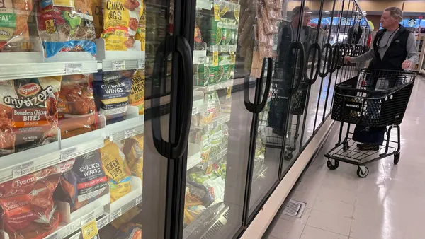A customer shops for frozen food at a grocery store on December 12, 2023, in San Anselmo, California.