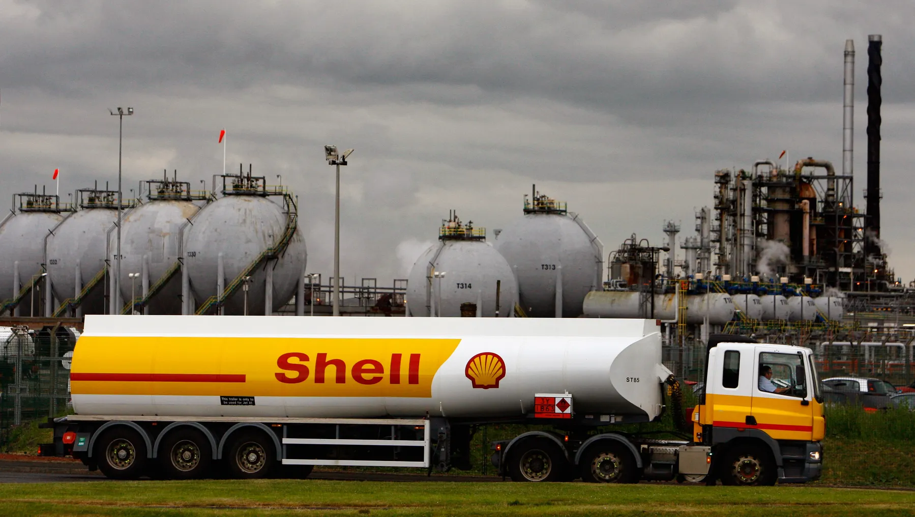 A Shell tanker is seen in front of an oil station.